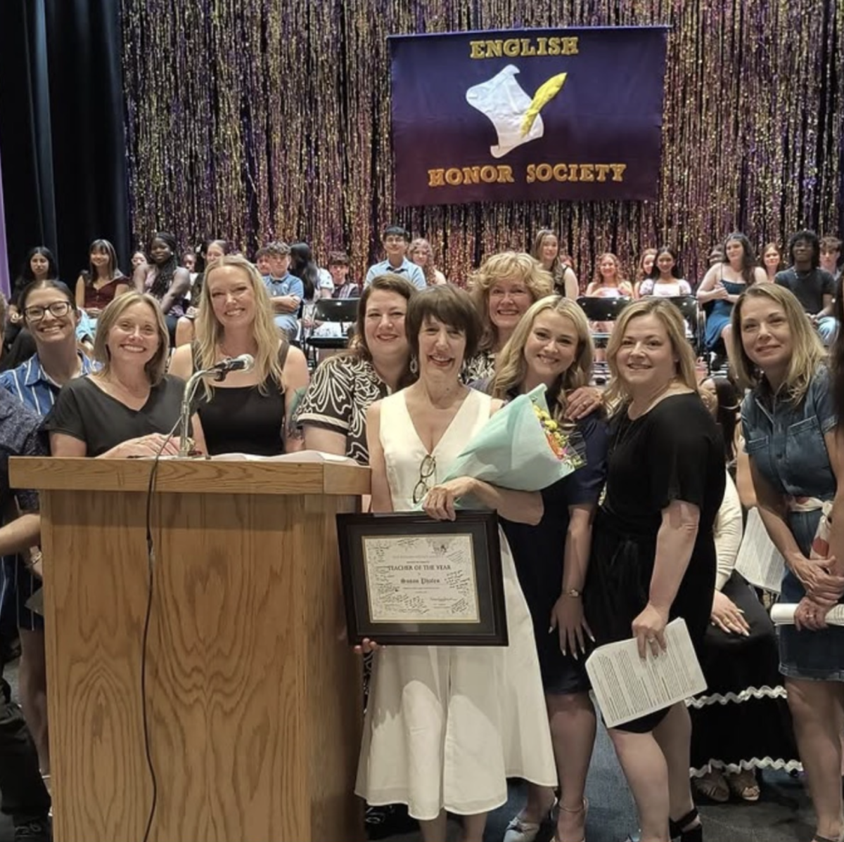 (Image courtesy of @clarkstownhsnorth on Instagram) 
Image of Ms. Phalen (center) and the English faculty at the English Honors Society Induction.